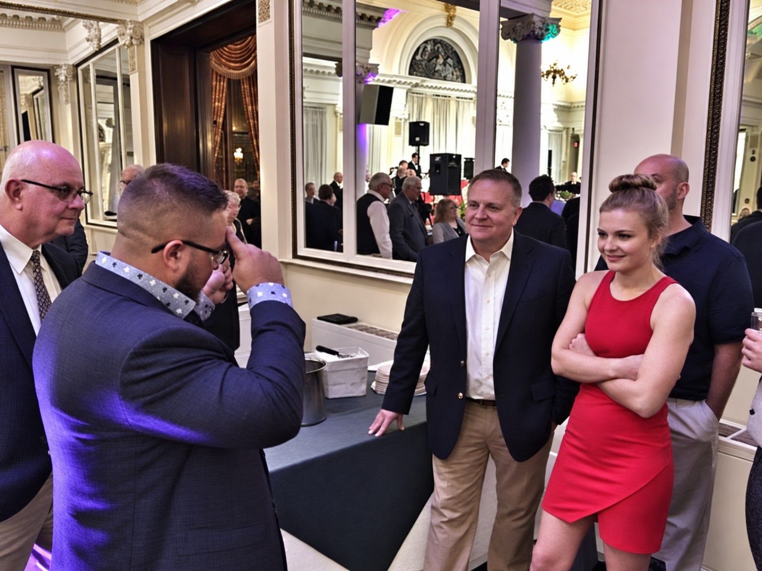 Guests gathered around Chris Wheel for close-up magic